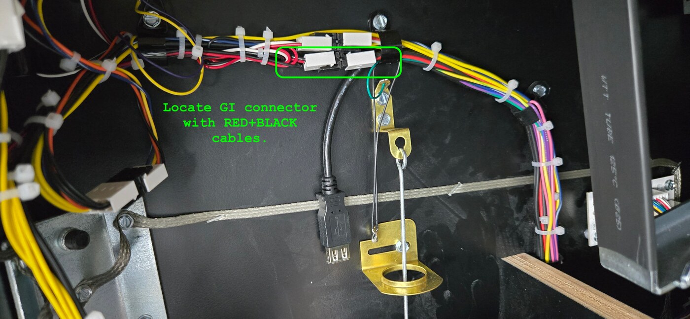 GI connector with red and black cables located on the left cabinet wall inside the coin door
